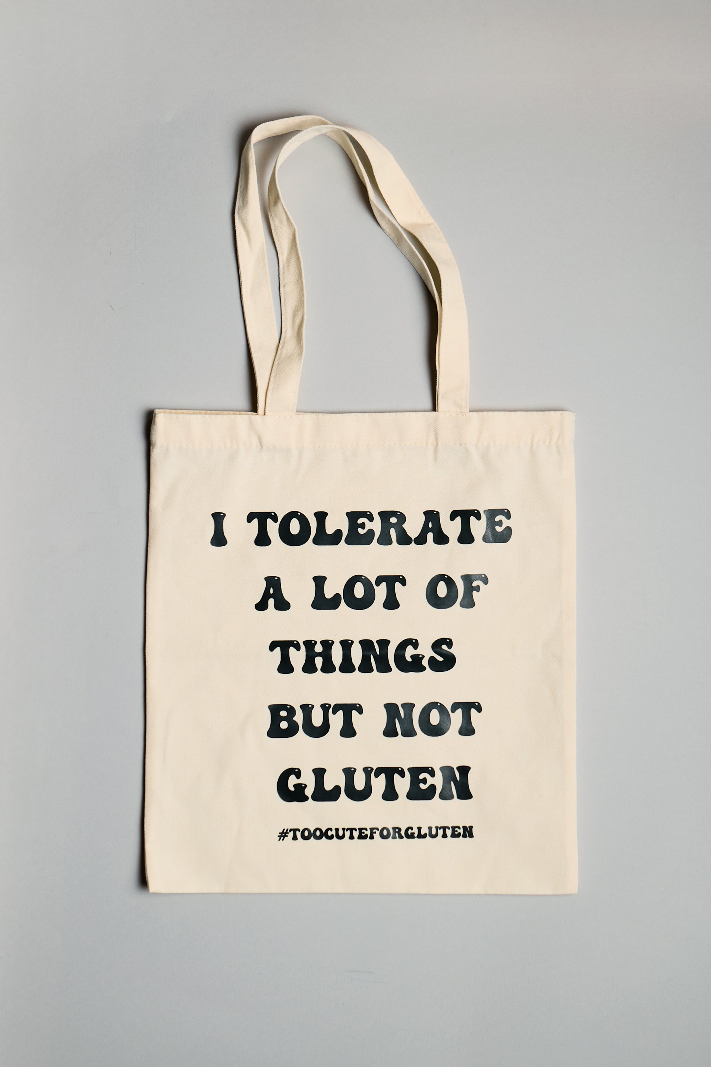 Béžová plátěná taška "I tolerate a lot of things but not a gluten"